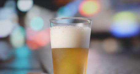 Beer with driving car at the background