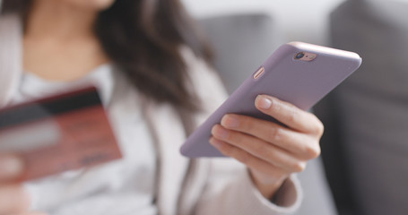 Online shopping concept with credit card and mobile phone