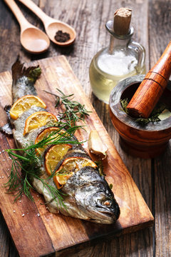 grilled fish with spices and olive oil