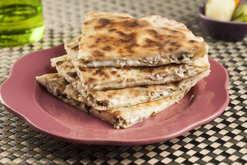 flat traditional italian flat bread filled with chicken and cheese