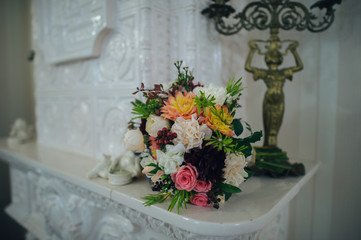 Wedding bouquet of pink and white roses and blue fresia