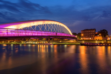 Bernatka footbridge over Vistula river in Krakow at night. Poland. Europe.