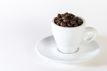 Coffee or espresso cup with coffee beans plain white background