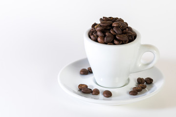 Coffee or espresso cup with coffee beans plain white background