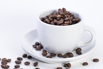 Coffee or espresso cup with coffee beans plain white background