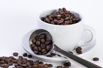 Coffee or espresso cup with coffee beans plain white background