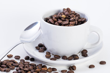 Coffee or espresso cup with coffee beans plain white background