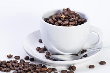 Coffee or espresso cup with coffee beans plain white background