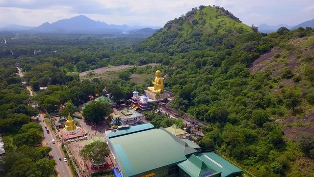 Golden Buddha Statue in Dambulla Sri Lanka drone footage