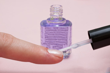 Manicure in beauty salon. SPA procedure, finger macro shot.
