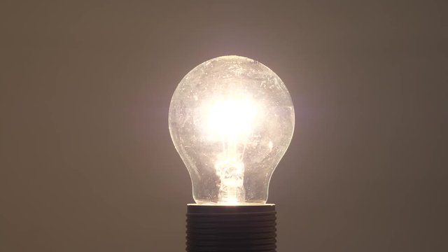 Incandescent light bulb turning on.