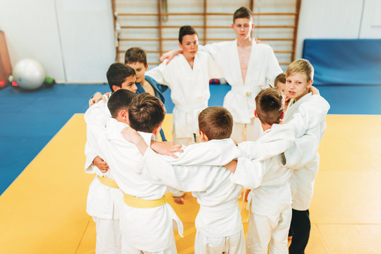 Boys in kimono on kid judo training indoor