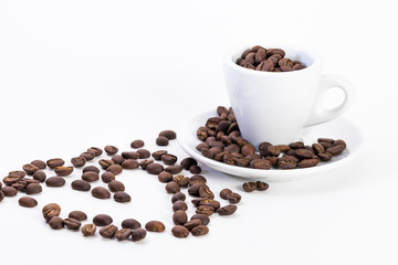 Coffee beans in a coffee or espresso cup next to a heart, Valentine's Day
