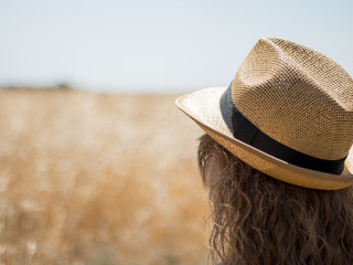 red dress woman with hat wheat field