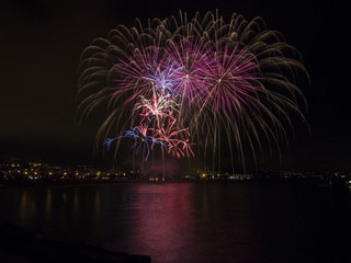 fireworks in beach reflection colored night