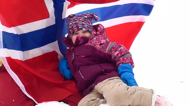 Little girl on a background of the Norwegian flag
