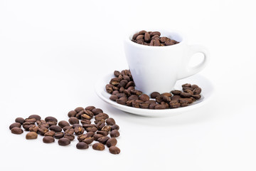 Coffee beans in a coffee or espresso cup next to a heart, Valentine's Day