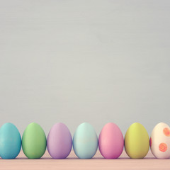 Top view of easter colorful eggs over blue background.