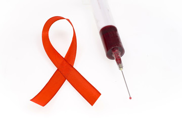 Health protection concept, aids, syringe and red ribbon