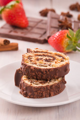 Chocolate roll with strawberries. 