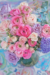 Beautiful bouquet of spring flowers in a vase on the table. Lovely bunch of flowers . 