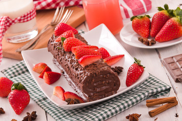 Chocolate roll with strawberries. 