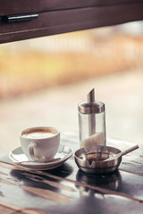 Three hedonistic addictions - coffee, sugar and cigarette in an ash-tray