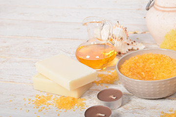 fruit bath salt with olive oil and gray natural soap next to the orchidwith place for text