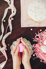  Easter cake and pink eggs on a  wooden table