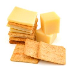 Delicious crackers with cheese on white background