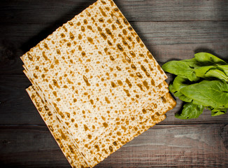 traditional Jewish kosher matzo for Easter pesah on a wooden table. Jewish Easter food. Spring.