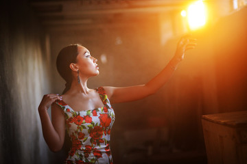 Silhouette of female face on sunset background