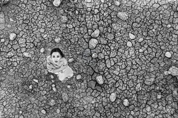 The model sits on the dried soil