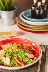 Bright vegetable salad with apple, tomatoes and carrot. Love for a healthy raw food concept. Perfect for the detox diet or just a healthy meal.