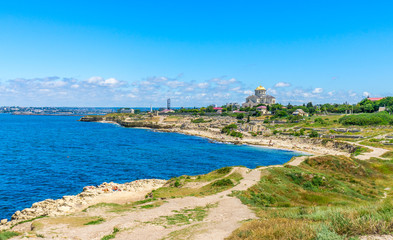 Fototapeta na wymiar Coast of the Black Sea in the ancient Greek city of Chersonese in summer in Sevastopol, Crimea, in Russia