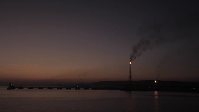 Refinery of petrochemical plant in sunrise