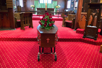 closeup shot of a colorful casket in a hearse or chapel before funeral or burial at cemetery