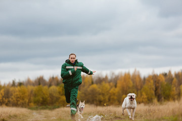 Man running with dogs
