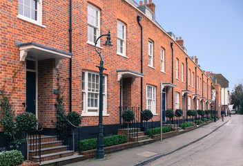 Red brick modern architecture terrace houses ( row houses ) with a retro, vintage Victorian sytle....