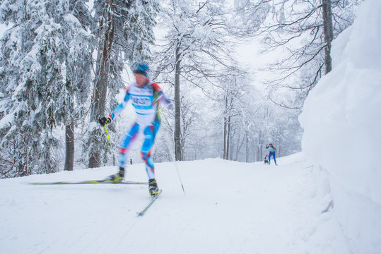 A woman cross-country skiing in the Alps