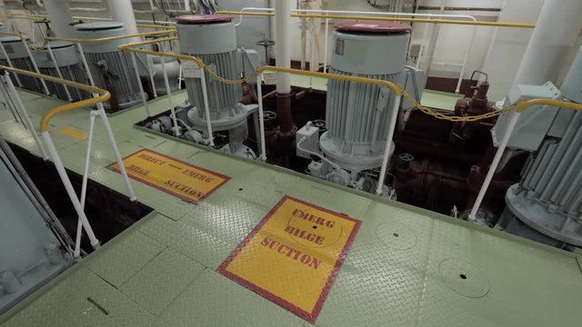 Emergency pumps with electric motors in engine room of ship