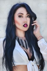 model with long hair, bright make-up and accessories