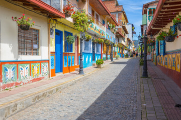 Colombia Guatape village street of the historic center with colorful colonial houses on a sunny day