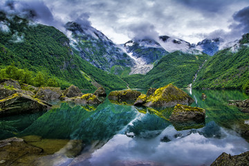 Naklejka na ściany i meble Amazing lake on a background of mountains and glacier. Norway. Beautiful landscape. Artistic picture. Beauty world.