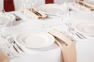 Tables set for an event party or wedding reception. luxury elegant table setting dinner in a...