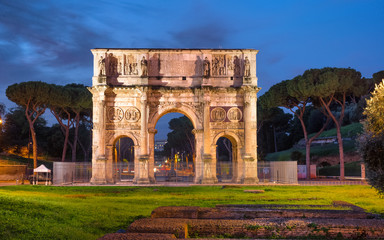 Night illumination of Arcus Constantini construction in Rome, Italy
