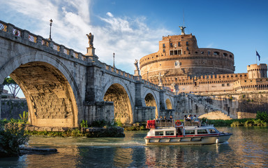 Boat on the Tiber river near Sant Angelo bridge and castle in Rome, Italy - 190817554