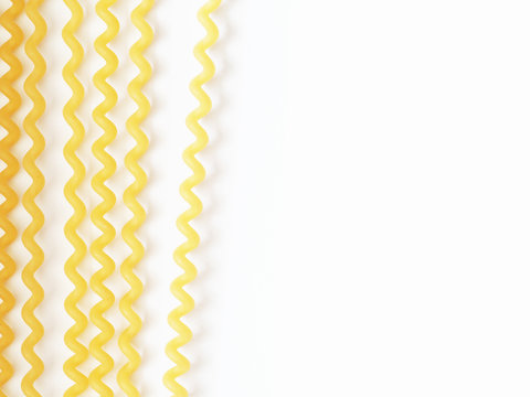 Long spaghetti fusilli isolated on the white background, pasta, macaroni, noodles. Traditional Italian food. Top view, close-up. Space for text