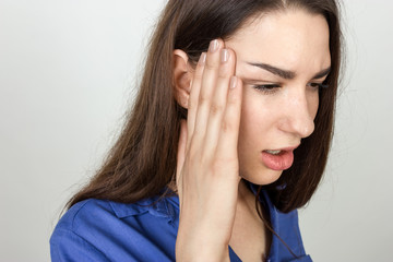 Portrait of a pretty woman  stress and headache having migraine pain
