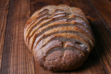Sliced bread on wooden background